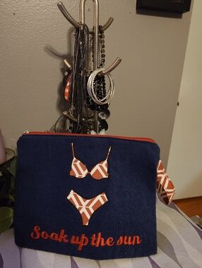 Navy 'Soak up the sun' Bathing Suit Storage  with Orange Geometric Bikini Accent